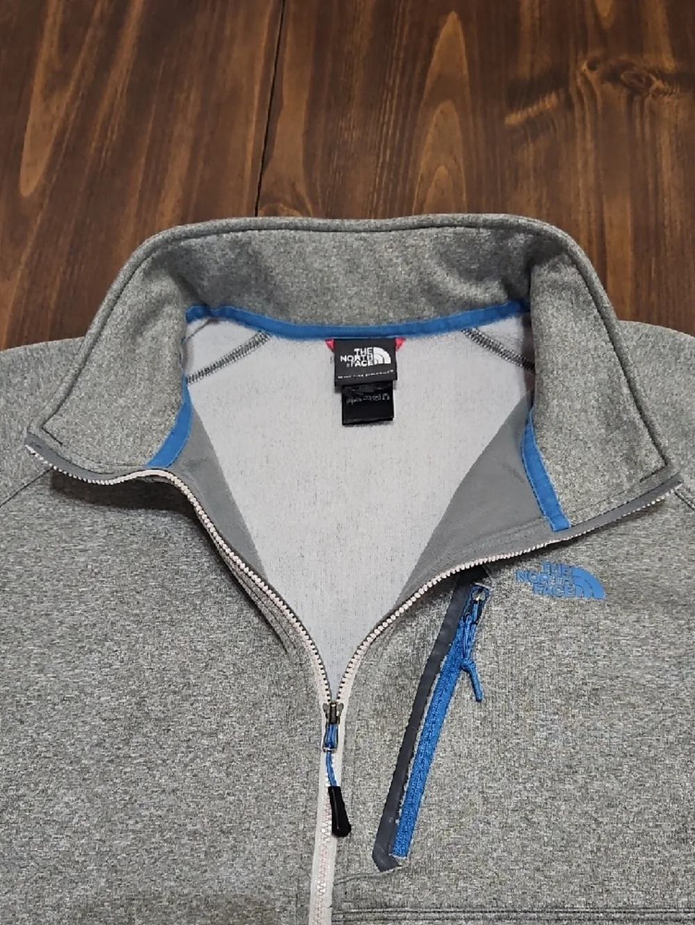 The North Face Men's Heather Gray Fleece Jacket with Blue Accents
